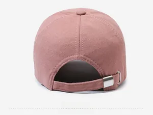 Rear view of pink cotton baseball cap showing adjustable metal buckle and stitching