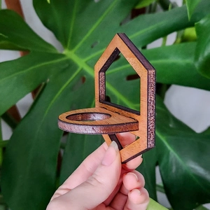 Close-up of wall-mounted wooden test tube planter with natural dark wood grain finish
