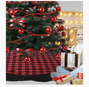 Close-up of red and black buffalo plaid Christmas tree skirt with plush flannel texture