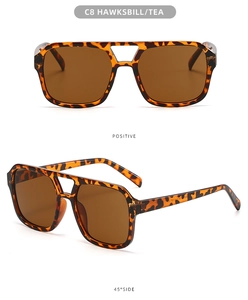 Detail of tortoise shell double bridge pilot sunglasses with tea lenses and metal hinges
