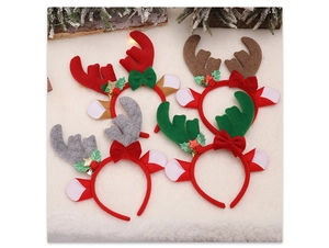 Detail of four colorful Christmas reindeer antler headbands with bells and holly leaves