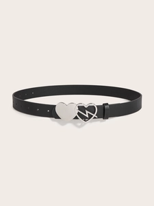 Detail of black belt with double heart buckle featuring a unique lightning bolt cutout design