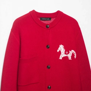 Women's red jacquard knit cardigan featuring a white horse pattern and button closure