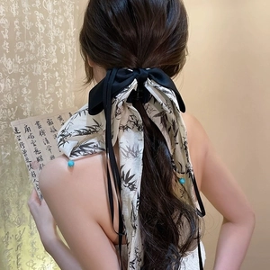 Elegant Chinese bow hair clip with ink bamboo ribbons and turquoise bead details