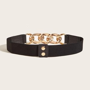 Detail of black elastic wide belt with golden metal chains and leather snap buttons