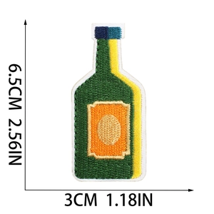 Detailed embroidery patch of a spirit bottle with dimensions 6.5cm x 3cm on white backdrop