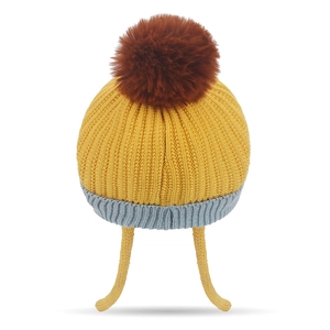 Kids knitted beanie with earflaps, yellow body, blue brim and a brown pompom