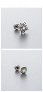 Macro detail of moonstone starburst and vintage round steel studs with blue-green flash