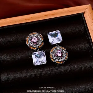 Vintage asymmetric camellia earrings with pink zircon and gun black plating in a gift box