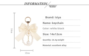 Macro detail of elegant ribbon bow keychain with pearl chain and golden coin charm