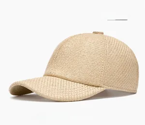 Detail of light khaki straw woven baseball cap showing breathable cross-weave texture