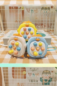 Detail of cute duck pop fidget toys in yellow, white, and blue with matching lanyards