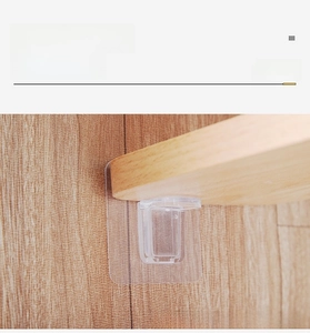 Macro detail of transparent self-adhesive shelf support bracket on a wood texture wall