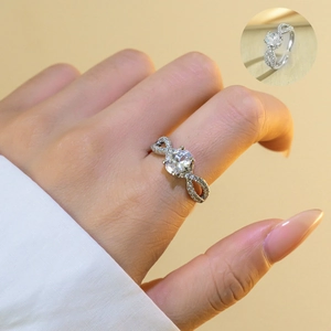 Detailed view of silver adjustable bow ring with infinity pavé crystals and central cubic zirconia