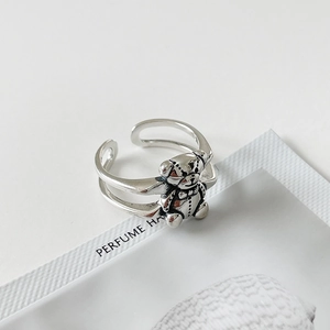Close-up of vintage 925 sterling silver teddy bear ring with retro textured finish