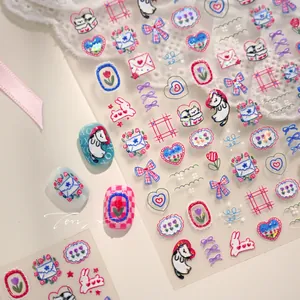 Detail of 3D embossed nail stickers featuring cartoon cats, rabbits and pink tulips