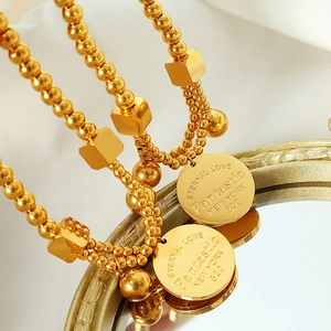 18k gold plated stainless steel beaded bracelet featuring lucky coin and square charms