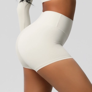 Close-up of cream high-waisted yoga shorts showing peach lift effect and fit