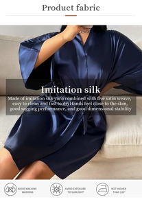 Detail of dark blue imitation silk bathrobe fabric showing high satin gloss and smooth texture