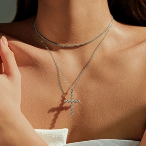 S925 sterling silver cross pendant necklace with VVS1 moissanite worn by a model