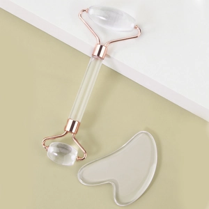 Transparent resin face roller and heart-shaped gua sha set with rose gold metal parts