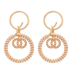 Elegant gold knotted pearl hoop earrings with interlocking CC logo in luxury vintage style