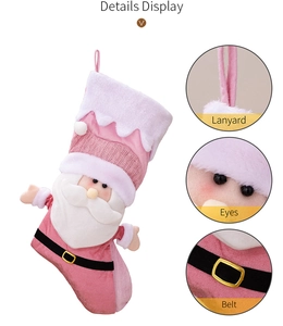 Close-up of pink Santa Claus stocking showing detailed plush texture and hanging loop