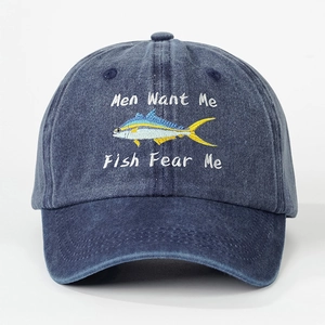Close-up of Fish Fear Me embroidery on a washed navy blue denim baseball cap