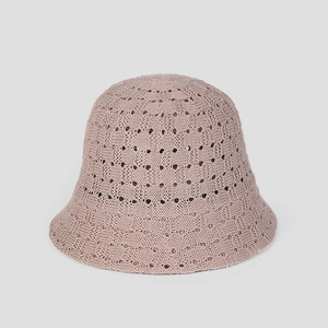 Detailed view of the breathable hollow knit pattern on a mauve crochet bucket hat
