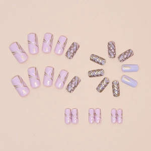 Lavender press-on nails with golden cat silhouettes and geometric patterns in 24 pieces