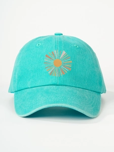 Close-up of mint green cotton baseball cap with sunray embroidery on white background