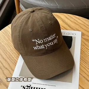 Dark brown cotton baseball cap with white No matter what you say embroidery