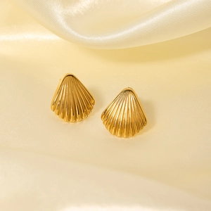 Elegant 18k gold plated stainless steel shell stud earrings on soft yellow silk background