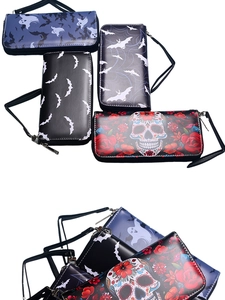 Detailed view of four vintage gothic wallets with bat and ghost patterns on PU leather