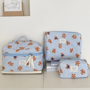 Three-piece set of blue striped quilted makeup bags with cute cartoon bear patterns