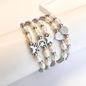 Five-piece stainless steel beaded bracelet set with pearls and assorted metal charms