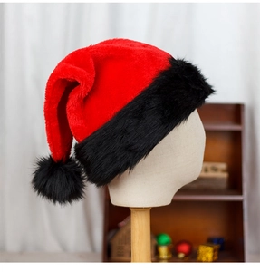 Detail of red plush Santa hat with black faux fur trim shown on a mannequin head