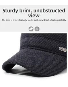 Detail of winter thermal cap showing thick twill fabric and stylish metal letter B emblem