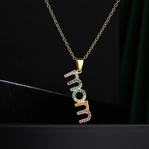 18K gold plated MOM pendant necklace with multi-color zircon stones on black display