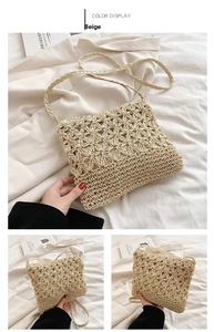 Detail of beige straw crossbody bag featuring hollow floral pattern and woven strap