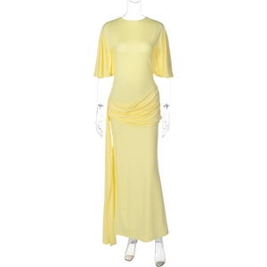 Detail of light yellow maxi dress featuring tiered waist pleats and elegant long ribbons