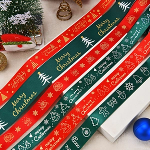 Festive red and green Christmas ribbons with gold Merry Christmas prints and holiday patterns