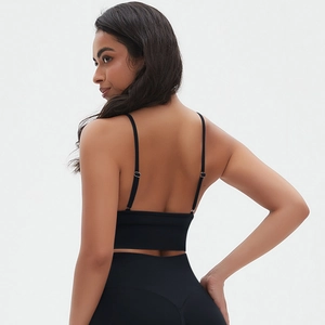 Detailed back view of a seamless black yoga sports bra with thin straps and open back design