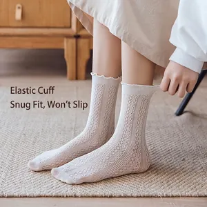 White lace mesh mid-calf socks with elastic cuffs and wavy ruffle trim for women