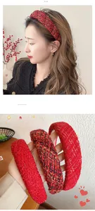 Macro shot of red tweed sponge headbands showing woven texture and vintage British style