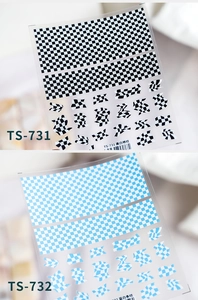 Detailed macro view of 5D embossed checkerboard nail stickers in black and white patterns