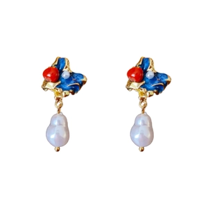 Vintage gold earrings with blue enamel, red bead and baroque pearl on white background