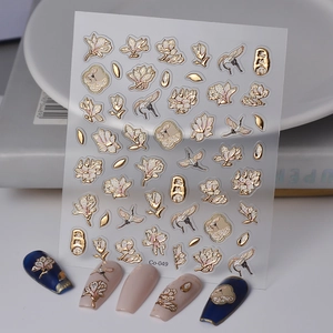 Macro detail of 5D embossed nail stickers featuring white magnolias and golden cranes