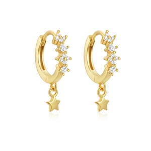 Detail of gold S925 silver hoop earrings with star charms and sparkling stones