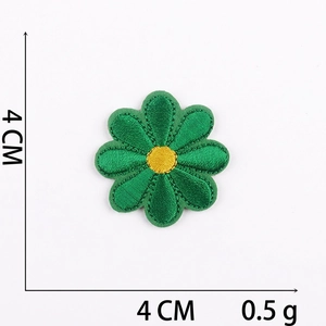 Detail view of a 4cm green floral embroidered patch with fine stitching and sizing